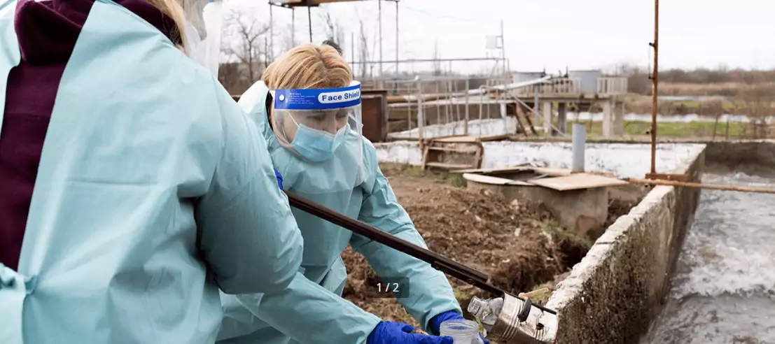 WHO / Christopher Black
Health workers take a wastewater sample at a sewage site near Uzhgorod, Ukraine, on 28 February 2023. Wastewater sampling provides a population-wide surveillance system, allowing health workers to monitor for poliovirus in large areas.